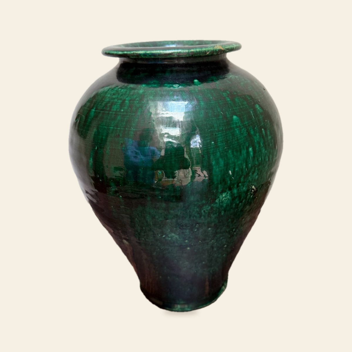 Antique redware vase with streaky green glaze